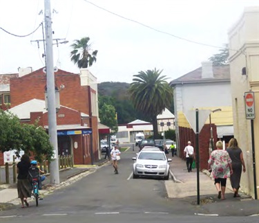Frederick Street with people and parked car